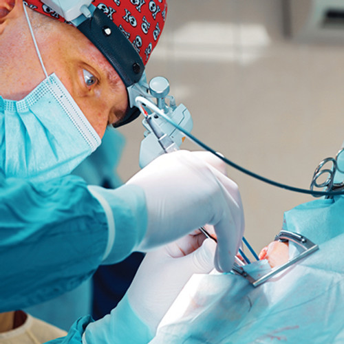 Oral surgeon performing an operation