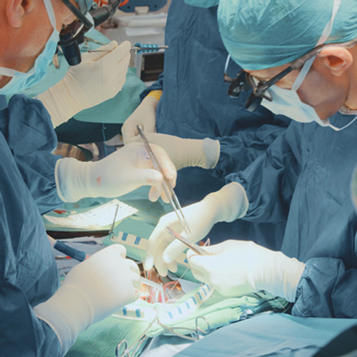 Operating room with medical professionals preparing for surgery
