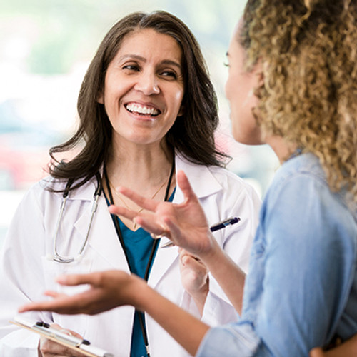 Female doctor consulting with a female patient