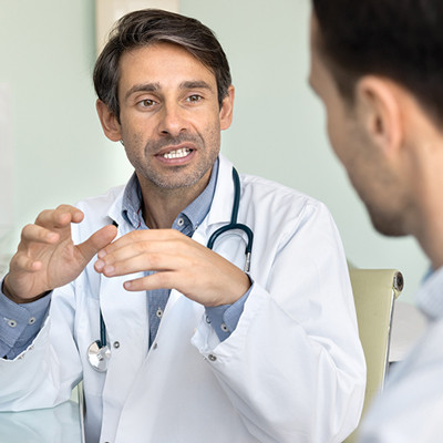 Doctor speaking with patient