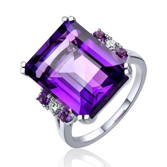 front view of amethyst and emerald cut and diamond ring in 14k white gold