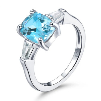 sky blue topaz and white zircon 3 stone ring in rhodium over sterling silver