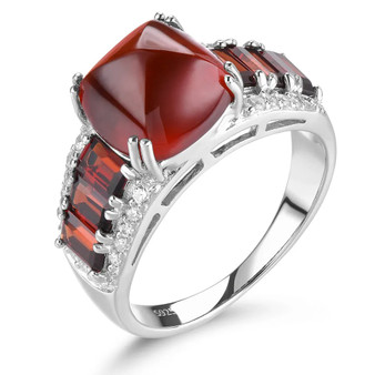 front view of sugarloaf cut hessonite garnet and white zircon ring in rhodium over sterling silver