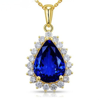 tanzanite and diamond halo necklace in 14k yellow gold