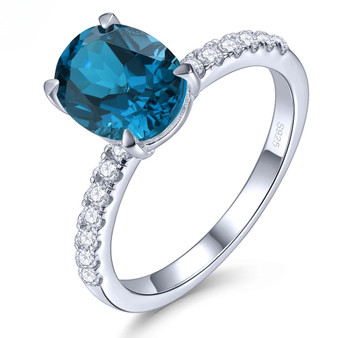 oval london blue topaz and white zircon ring in rhodium over sterling silver