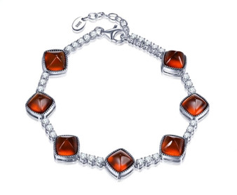 sugar loaf cut hessonite garnet and white zircon tennis bracelet in rhodium over sterling silver