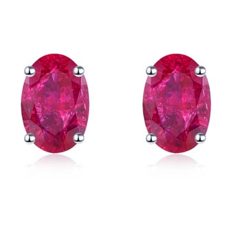 6x4mm oval ruby stud earrings in rhodium over sterling silver