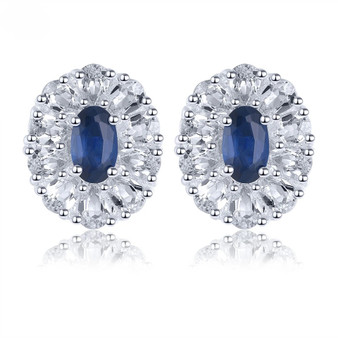 blue sapphire and white zircon halo stud earrings in rhodium over sterling silver