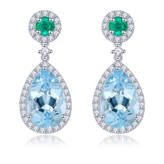 sky blue topaz emerald and white zircon dangle earrings in rhodium over sterling silver