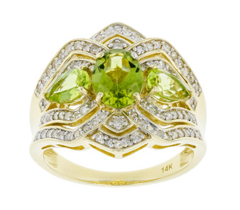 front view of peridot and diamond wideband three stone ring in 14k yellow gold