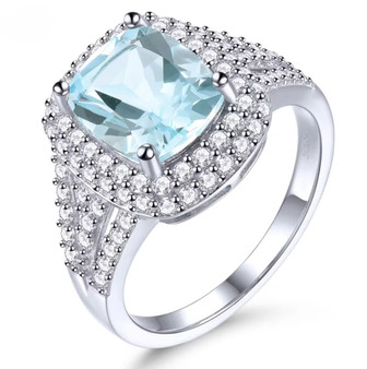 sky blue topaz and white zircon halo ring in rhodium over sterling silver