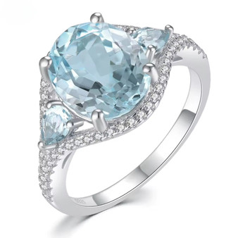 sky blue topaz three stone and white zircon accent ring in rhodium over sterling silver