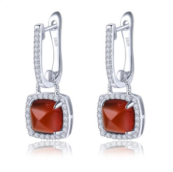 sugar-loaf cut hessonite garnet dangle earrings in rhodium over sterling silver