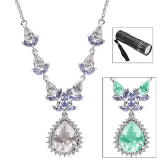 hyalite opal center glows green under uv light with included uv flashlight on hyalite opal tanzanite and moissanite necklace