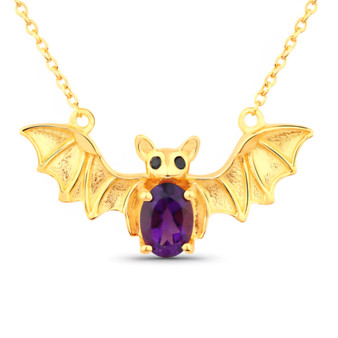 front centered view of bat necklace with oval amethyst body and black spinel eyes in 18k yellow gold over sterling silver