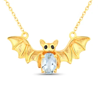 front view of bat necklace oval with sky blue topaz and black spinel in 18k yellow gold over sterling silver