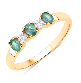 front view of alexandrite and oval diamond trilogy ring in solid 18k yellow gold
