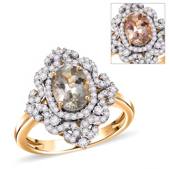 front angled view of turkish diaspore turkizite and moissanite halo ring in two tone gold and rhodium plated sterling silver showing color change center stone
