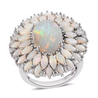 front angled view of australian opal and moissanite halo ring in rhodium plated sterling silver with oval cabochon opal center front angled view of australian opal and moissanite halo ring in rhodium plated sterling silver with oval cabochon opal center