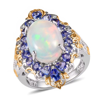 front angled view of ethiopian welo opal and tanzanite ring in 18k yellow gold and rhodium plated sterling silver with oval opal center front angled view of ethiopian welo opal and tanzanite ring in 18k yellow gold and rhodium plated sterling silver with oval opal center