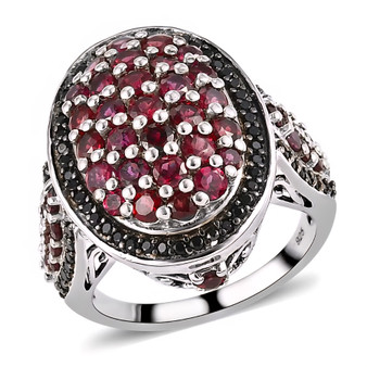 front view of anthill garnet oval and black spinel ring in black and white rhodium over 925 sterling silver