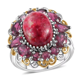front view of thulite and rhodolite halo cocktail ring in two-tone 18k yellow gold and rhodium over sterling silver featuring oval thulite cabochon surrounded by faceted rhodolite garnets