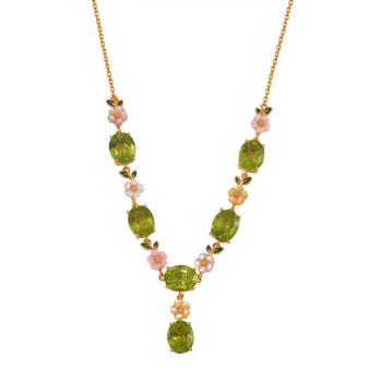 front view of peridot and mother of pearl floral necklace in 18k yellow gold over silver
