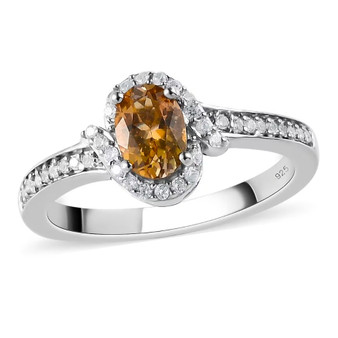 front view of golden tanzanite and white zircon halo ring in rhodium over sterling silver