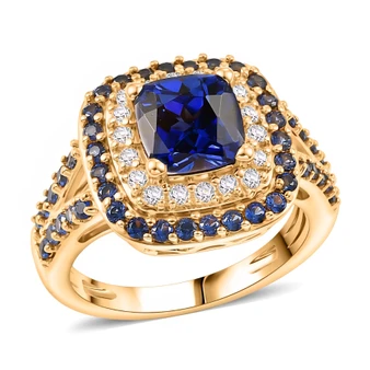 front view of lab created blue and white sapphire halo ring in 18k yellow gold over sterling silver