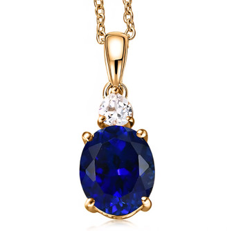 lab created blue and white sapphire pendant necklace in 18k yellow gold over sterling silver