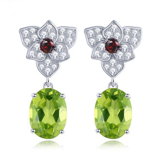 front view of peridot garnet and white zircon dangle earrings in rhodium over sterling silver