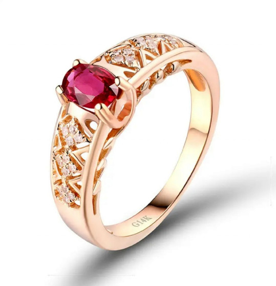 open view of ruby and diamond open work ring in 14k yellow gold