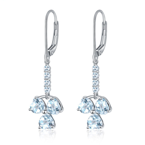 sky blue topaz heart dangle earrings in rhodium over sterling silver
