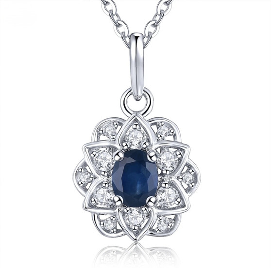 front view of sapphire and white zircon flower halo necklace in rhodium over sterling silver