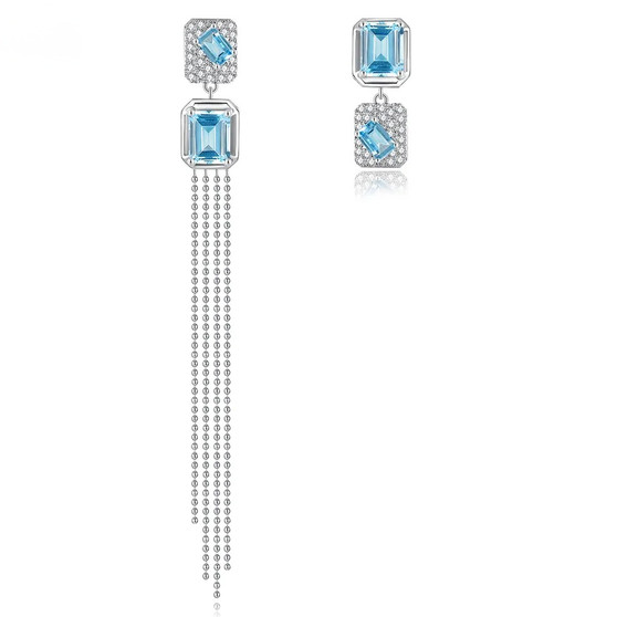 sky blue topaz and zircon mismatched dangle earrings in rhodium over sterling silver