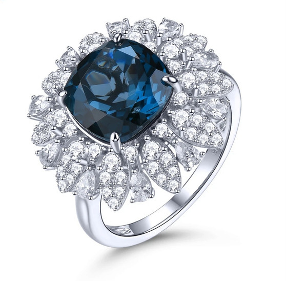 london blue topaz and white zircon halo ring in rhodium over sterling silver