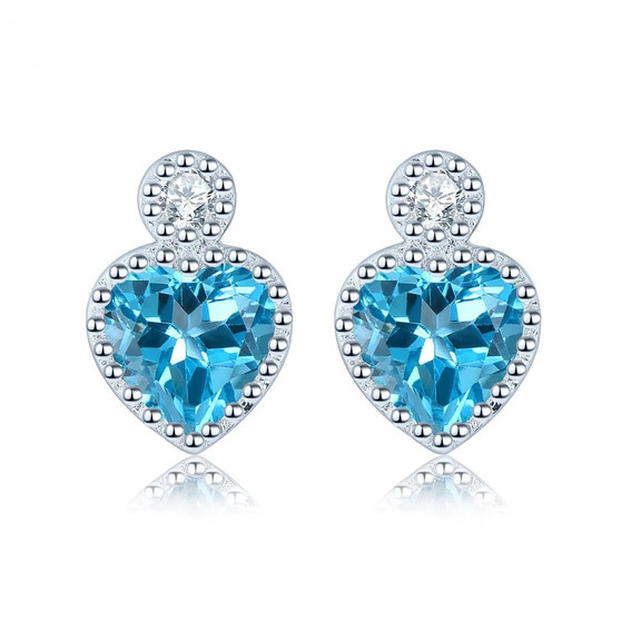 blue topaz and white zircon heart stud earrings in rhodium over sterling silver