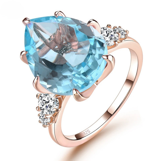 sky blue topaz and white zircon ring in 18k rose gold over sterling silver