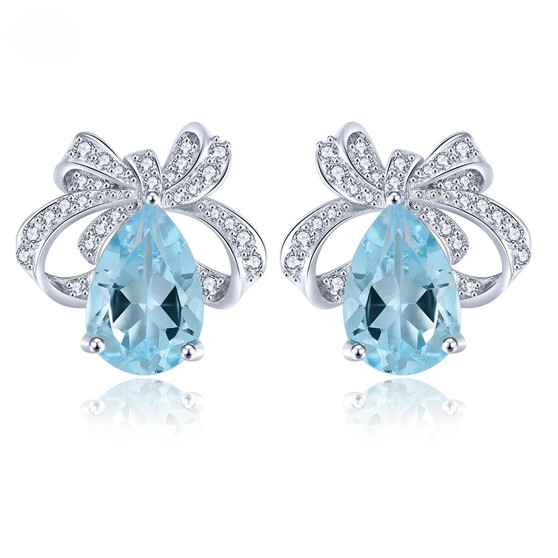 sky blue topaz and white zircon bow earrings in rhodium over sterling silver