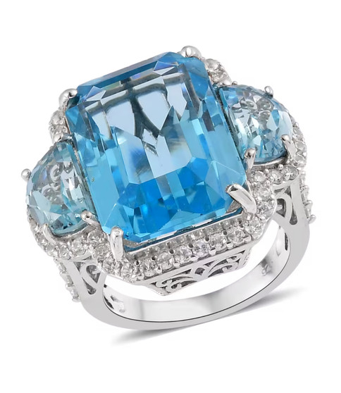 sky blue topaz and white zircon three stone halo ring in rhodium over sterling silver