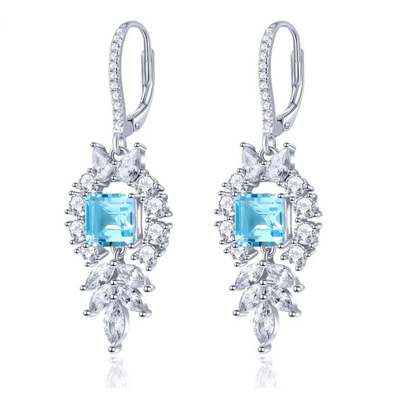 sky blue topaz and white zircon dangle earrings in rhodium over sterling silver