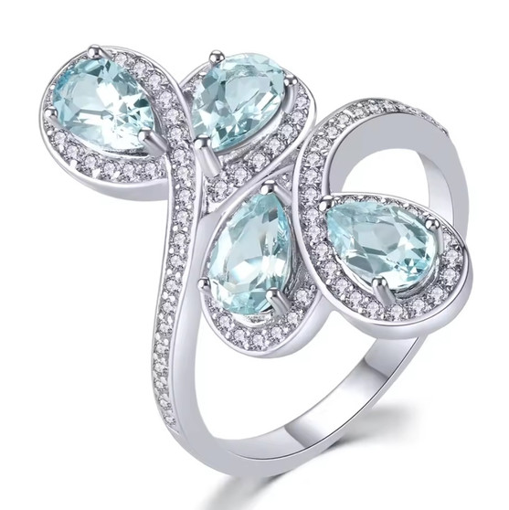 aquamarine and white zircon bypass ring in rhodium over sterling silver