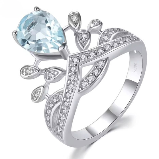 sky blue topaz and white zircon crown ring in rhodium over sterling silver
