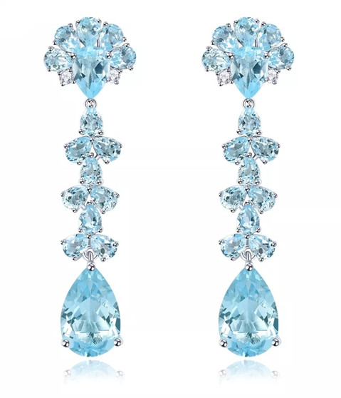 sky blue topaz flowering dangle earrings in rhodium over sterling silver