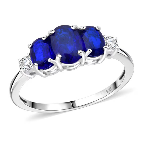 blue spinel trilogy ring and moissanite accents in rhodium over sterling silver
