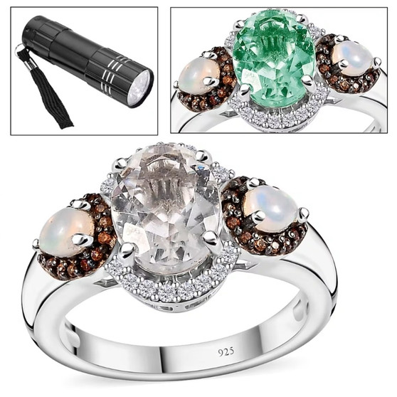 hyalite Opal ring front view shown under UV light revealing its green fluorescence with included UV flashlight accessory