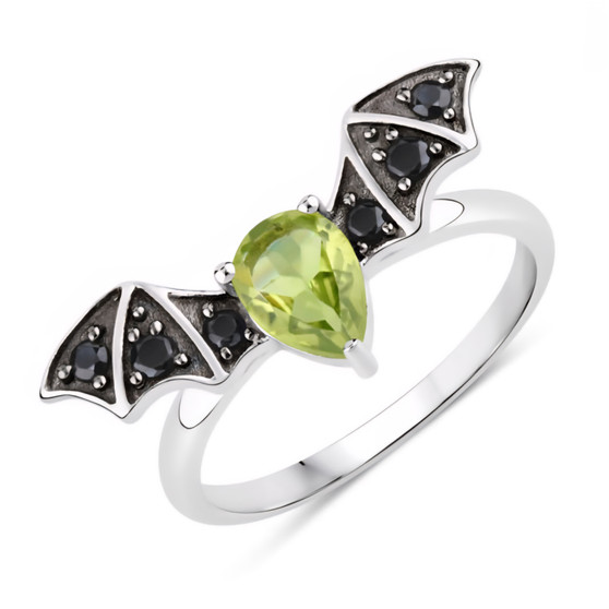 front view of bat wing ring with peridot and black spinel in black and white rhodium over sterling silver