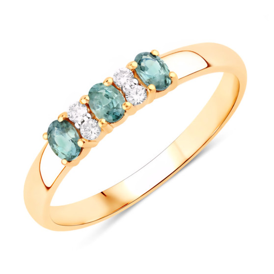 front angled view of alexandrite and diamond trilogy band ring in 18k yellow gold with oval color change gemstones and round diamond accents