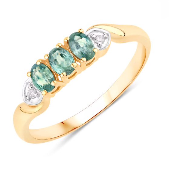 front angled view of alexandrite and diamond trilogy ring in 18k yellow gold featuring three oval color change gemstones and round diamonds in bezel frames
