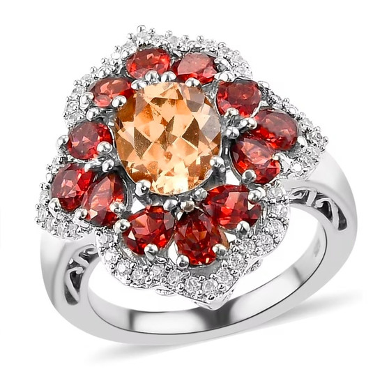 front view of imperial garnet and red garnet cocktail ring with zircon halo in polished rhodium over sterling silver